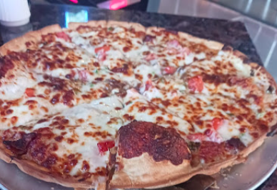 The Pumphouse signature dishes The Meat Pizza
Beer, Pig, & Cheese Pizza
Chicken Strip Basket